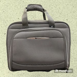 Delsey Silver Rolling Underseat Carryon Bag.